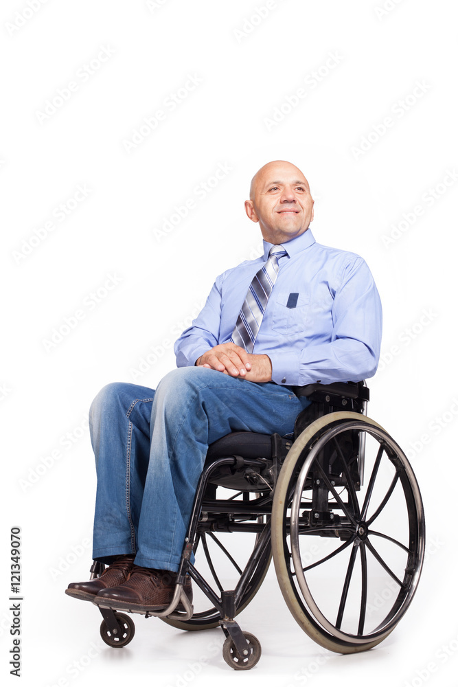 Disabled man in an office suit is preparing to start work. Disabled man in an office suit is preparing to start work.
