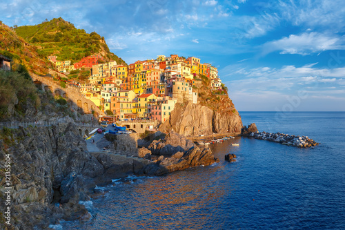 Aerial panoramic view of Manarola fishing village in Five lands, Cinque Terre National Park in the evening, Liguria, Italy.