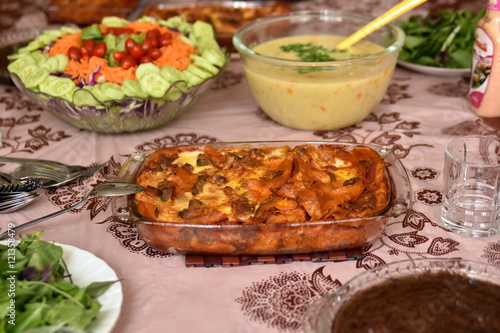 Iranian cuisine with lasagna and salad