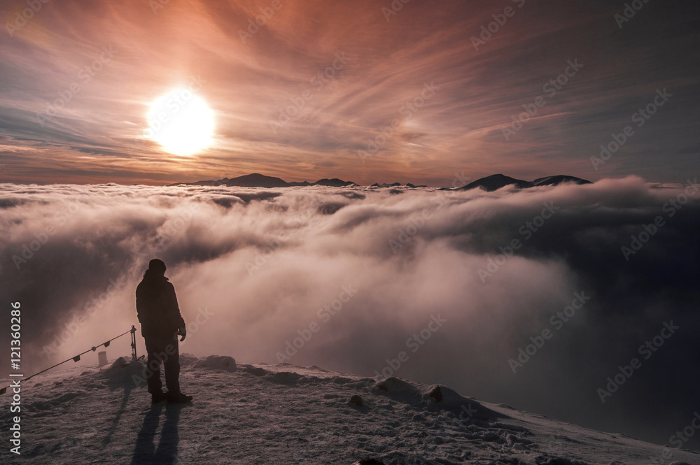 Beautiful mountain landscape. Man stands on top of a mountain. Tatry