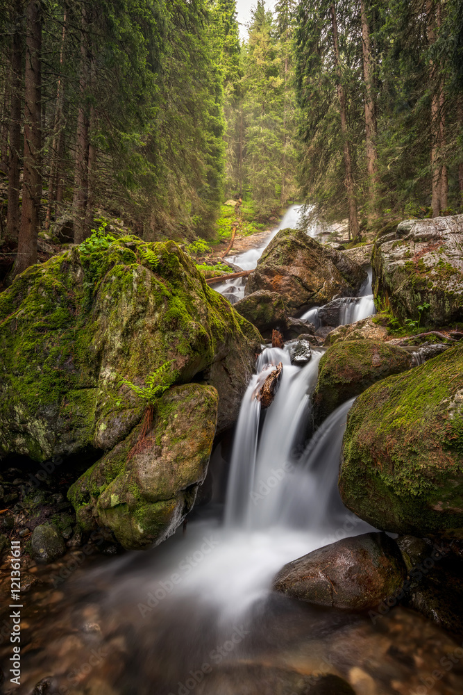 Beautiful waterfall among cliffs, Skakavica river in Rila Mountains, Bulgaria Beautiful waterfall among cliffs, Skakavica river in Rila Mountains, Bulgaria