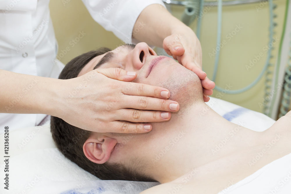 Obraz premium man in the mask cosmetic procedure in spa salon