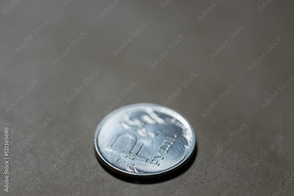 New coin one russian rouble on old paper background
New coin one russian rouble on old paper background
