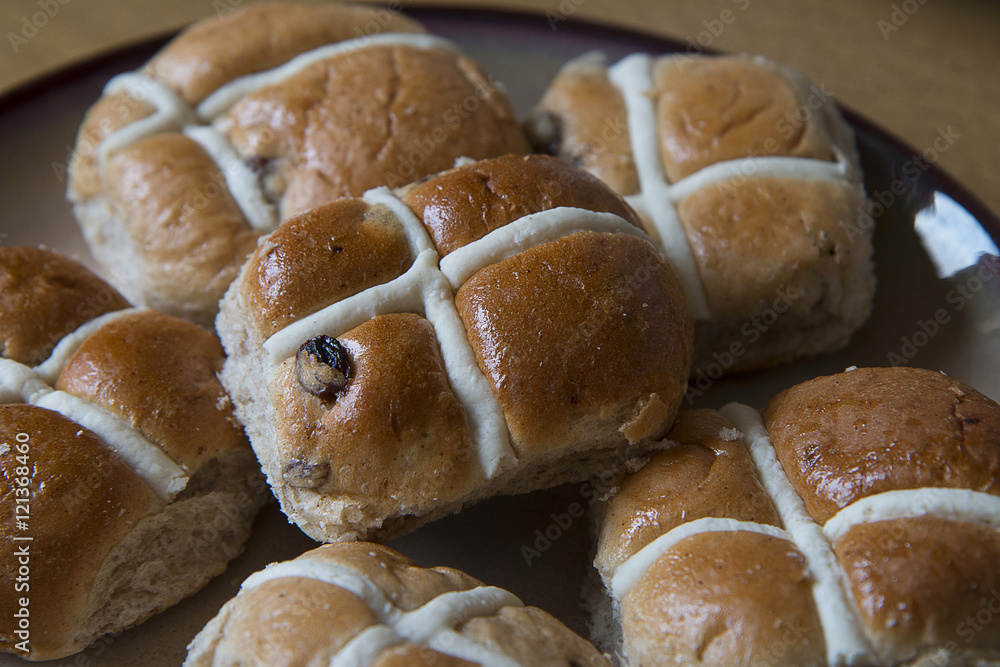 Hot cross buns waiting to be toasted, buttered and eaten at Easter Hot cross buns waiting to be toasted, buttered and eaten at Easter