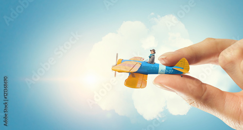 Student girl in old airplane . Mixed media
