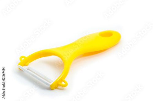 Yellow ceramic peeler for fruits and vegetables isolated on whit