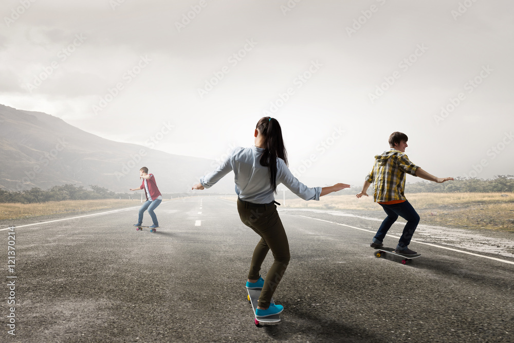 Fototapeta premium Teenagers ride skateboards . Mixed media