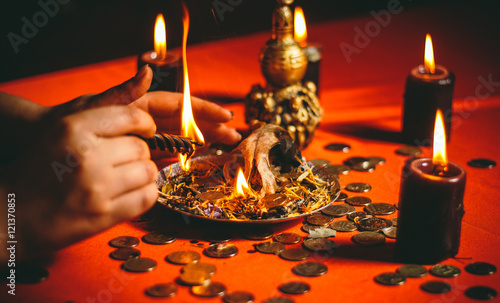 a witch holds a ritual for money