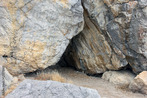 small cave in crevice of rock in crimean mountains
