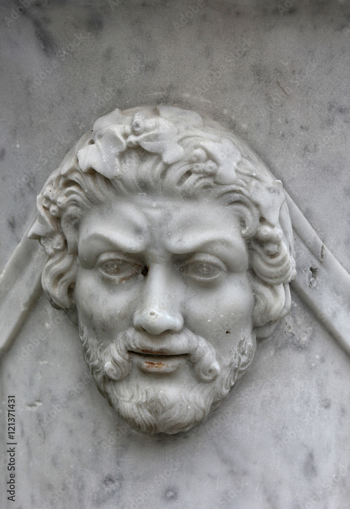 marble bas-relief in the form of ancient man face with beard on