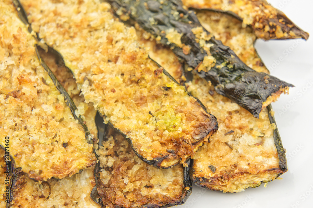 Baked zucchini slices closeup