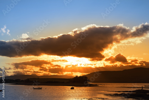 wild atlantic way ireland with an red sunset photo