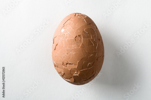 Broken Brown Egg on White Background