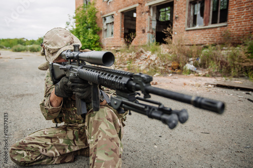 Army sniper during the military operation in the city. war, army © kaninstudio