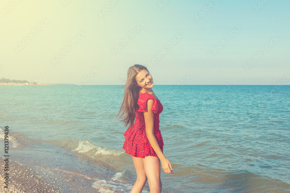 Young happiness woman on the sea
