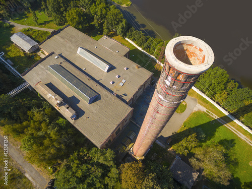 Aerial view of combined heat and power plant with chimney. Heavy industry from above. Power and fuel generation in Czech Republic, European Union 