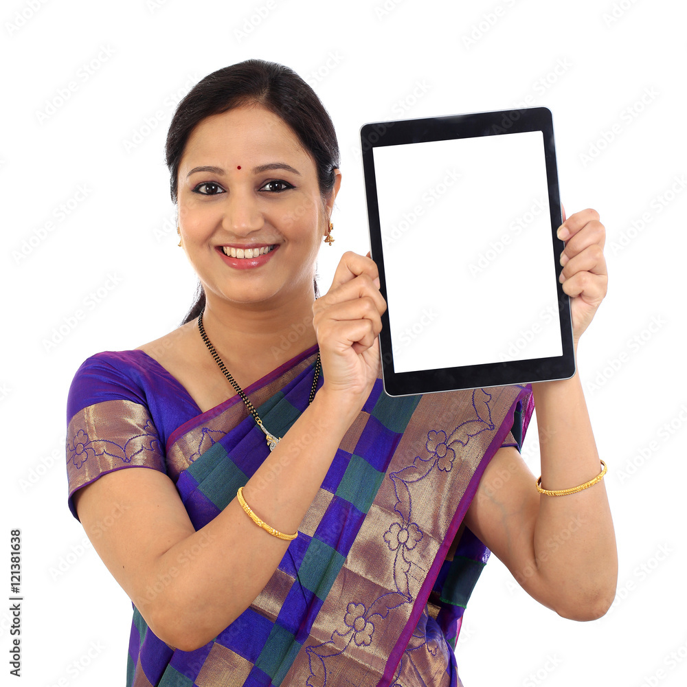 Traditional Indian woman using a tablet computer Traditional Indian woman using a tablet computer