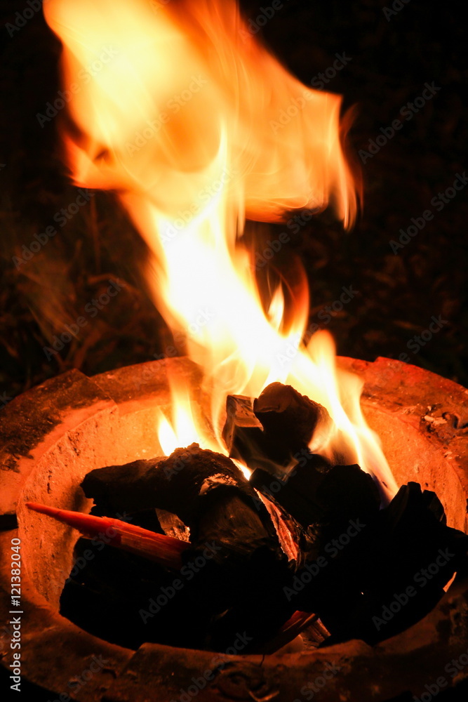 Flame in traditional fireplace kitchen in Thailand.
