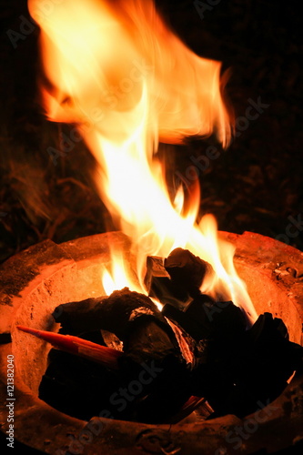 Obraz na płótnie Flame in traditional fireplace kitchen in Thailand. w salonie