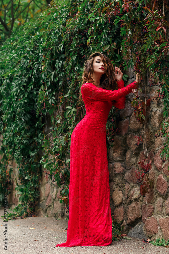 beautiful young woman in long red dress