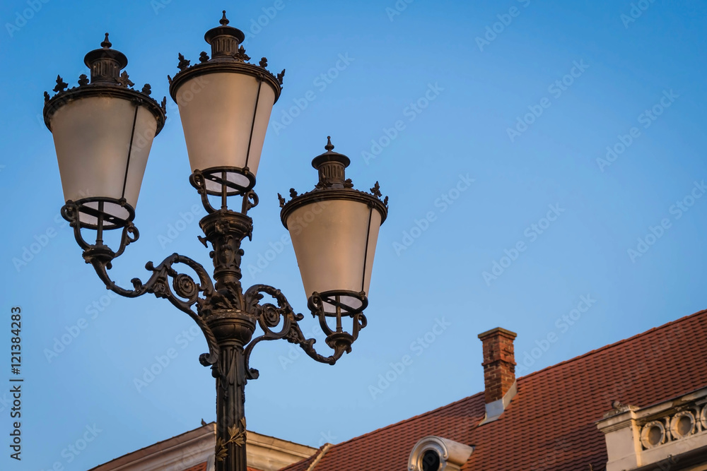 Three armed lamp post