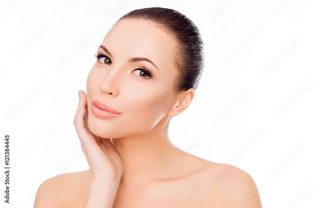 Portrait of pretty young woman touching her face Portrait of pretty young woman touching her face