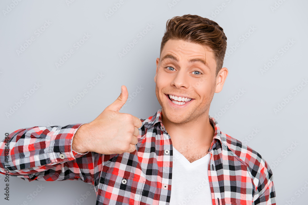 Portrait of young toothy man showing Portrait of young toothy man showing