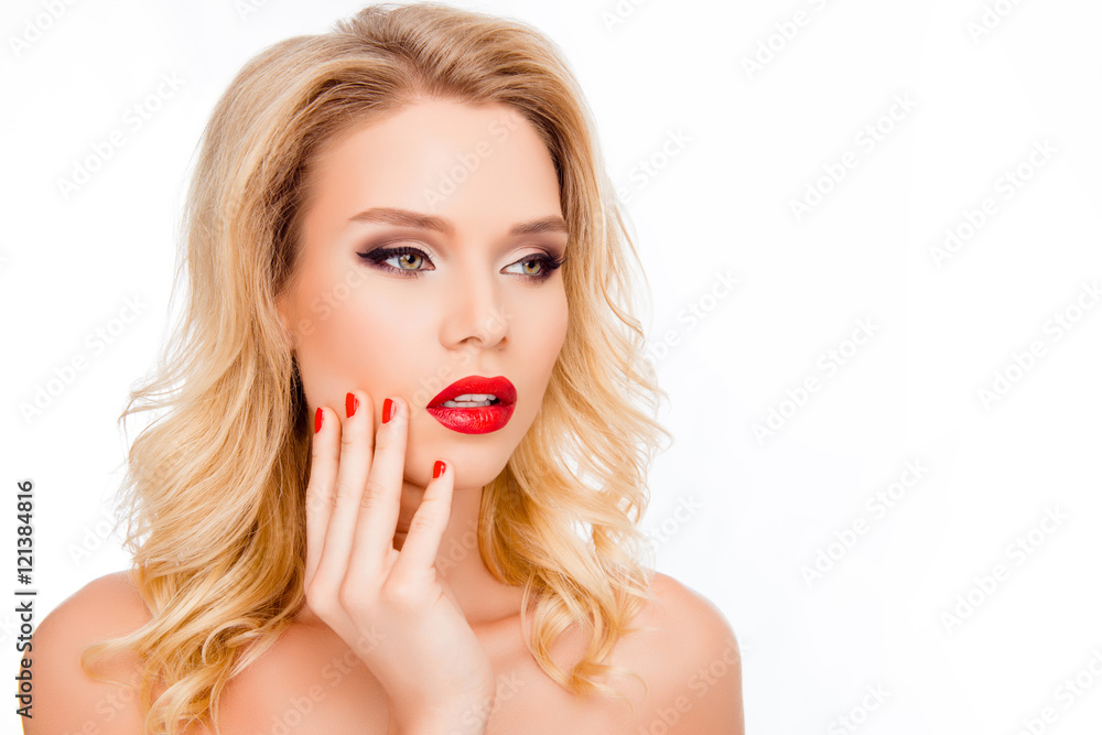 Portrait of pretty young blonde with red lips touhing face Portrait of pretty young blonde with red lips touhing face