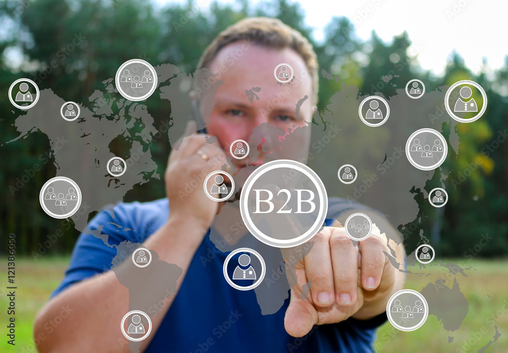 Businessman pressing button on virtual B2B screens. The concept of the business consultant - a businessman has touched business touch screen. The web icons.