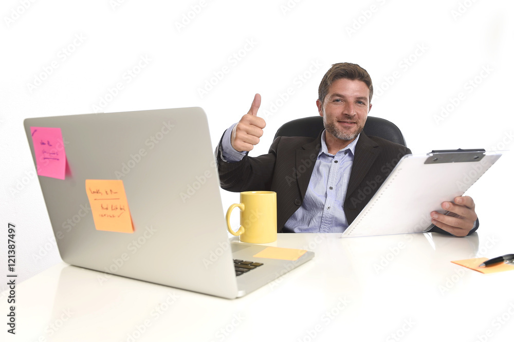 young attractive businessman happy confident at office working on laptop computer young attractive businessman happy confident at office working on laptop computer
