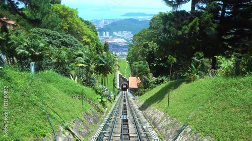 Ride on cable car road on Penang hill, Georgetown, Malaysia. View from inside.