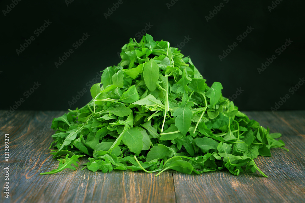 Concept of healthy eating, vegetarian diet heap of ruccola leaves, wild rocket salad Concept of healthy eating, vegetarian diet heap of ruccola leaves, wild rocket salad