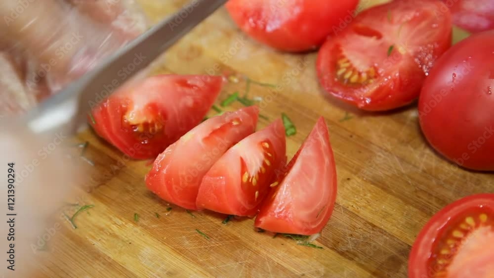 hands cut tomatoes for salad hands cut tomatoes for salad