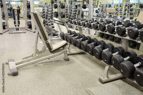 Interior of a fitness hall with wights and other sport equipment