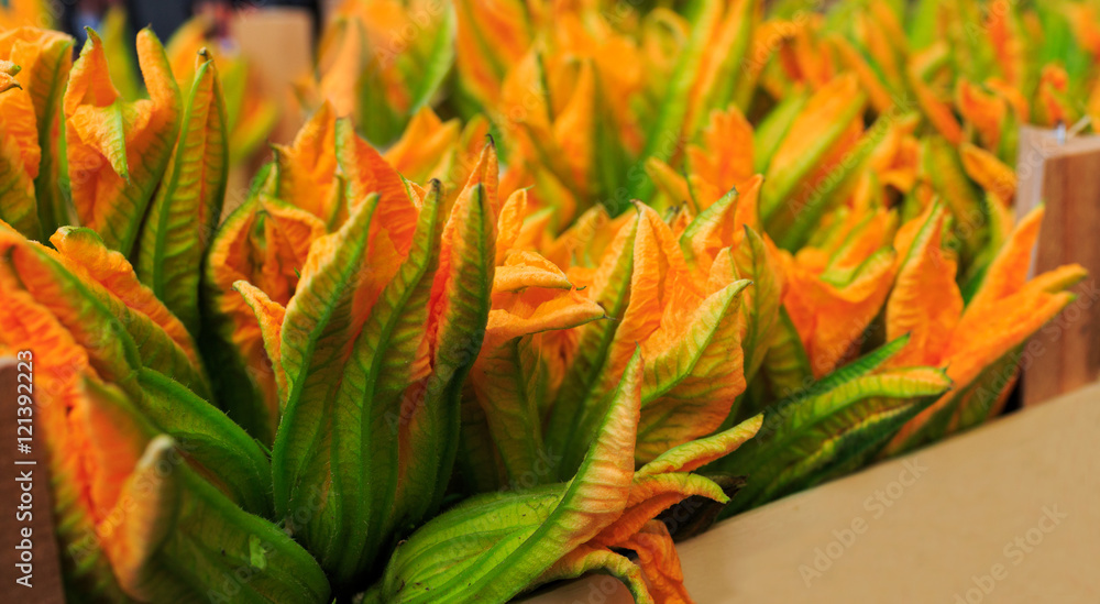 Obraz premium Zucchini flowers for sale at a Rialto market in Venice, Italy. c