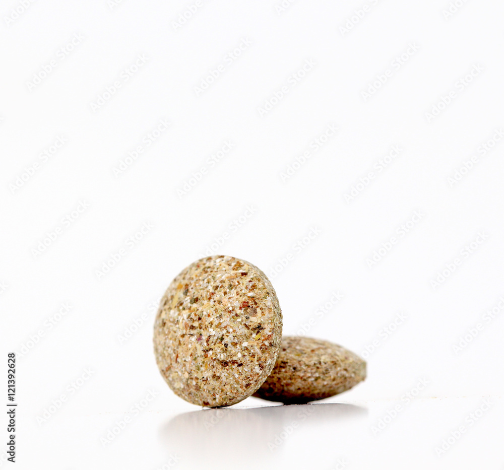 Close Up of Plain Compress pills of Medicinal Herb Close Up of Plain Compress pills of Medicinal Herb