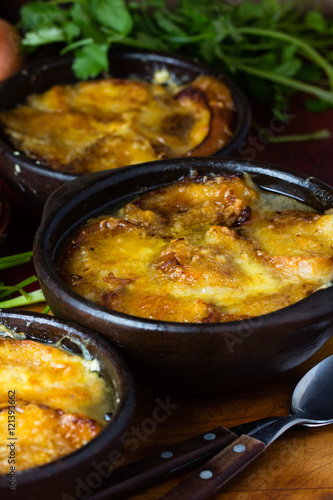 Onion soup with dried bread and cheddar cheese