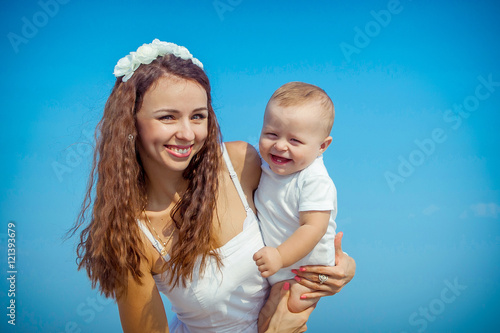 Mother and her son having fun on the beach