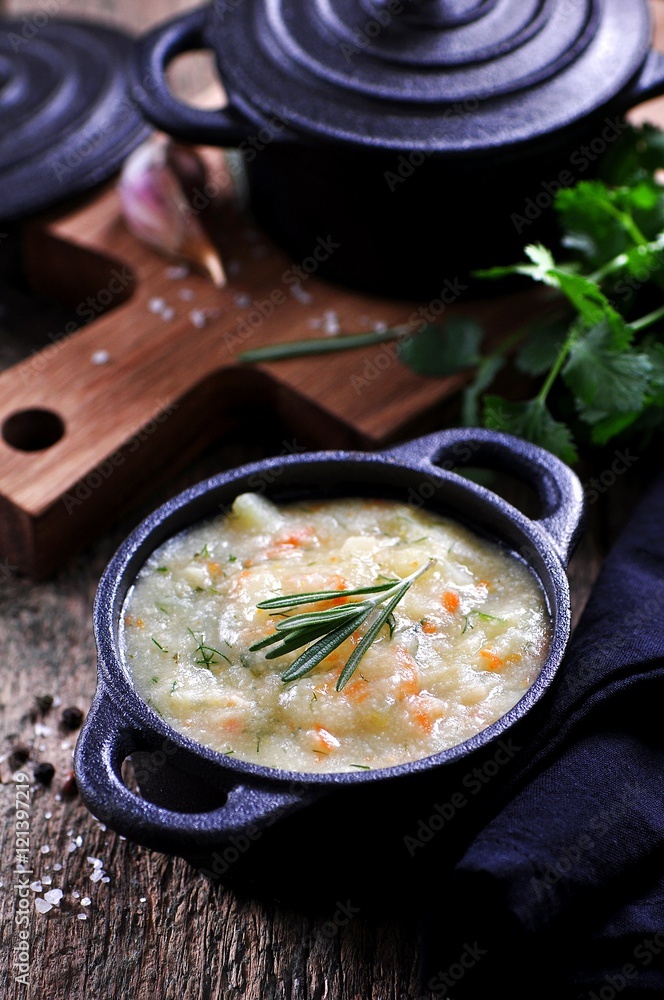 Thick soup of corn grits with potatoes, carrots, garlic, dill and coriander Thick soup of corn grits with potatoes, carrots, garlic, dill and coriander