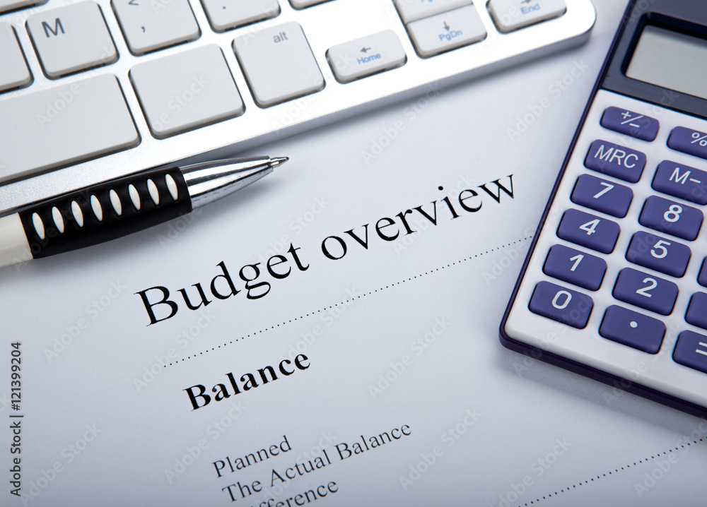 document with title budget overview and keyboard, calculator document with title budget overview and keyboard, calculator