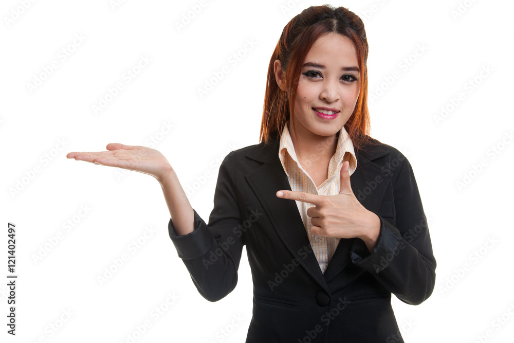 Beautiful young Asian woman point to palm hand. Beautiful young Asian woman point to palm hand.