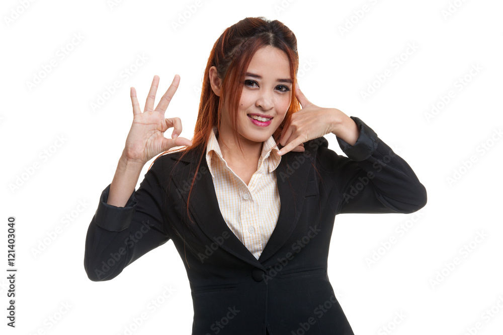 Young Asian woman show with phone gesture and OK sign. Young Asian woman show with phone gesture and OK sign.