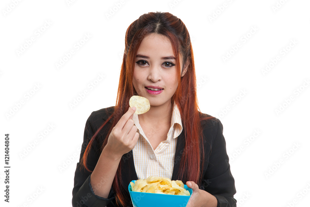 Young Asian woman eat potato chips. Young Asian woman eat potato chips.