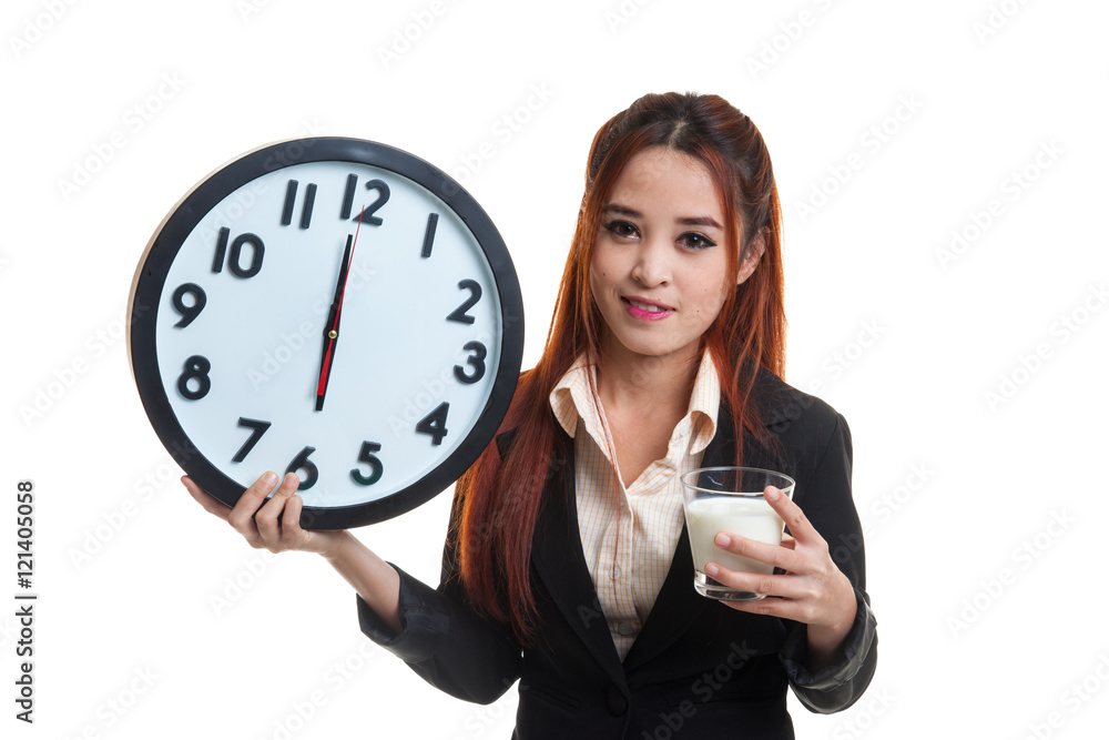 Healthy Asian woman drinking glass of milk hold clock. Healthy Asian woman drinking glass of milk hold clock.