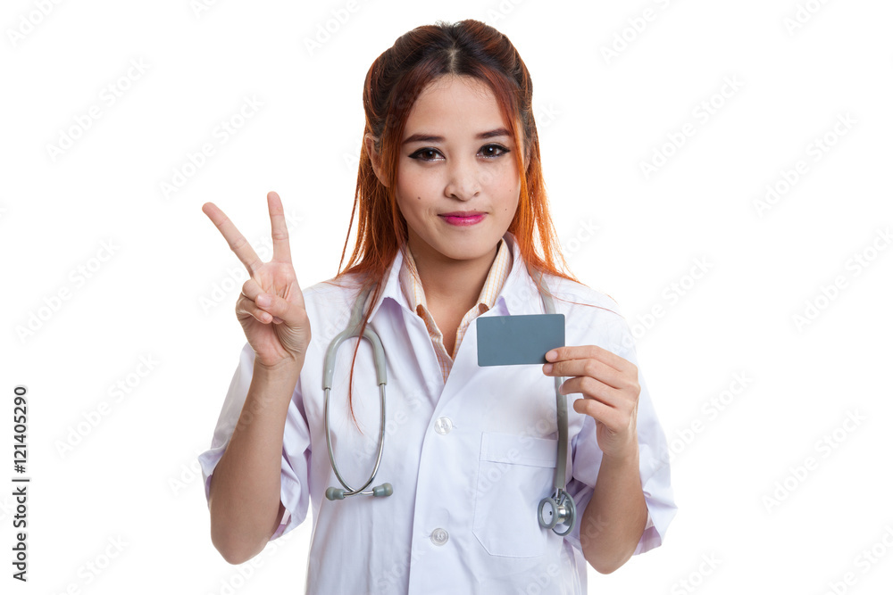 Asian young female doctor show victory sign with blank card. Asian young female doctor show victory sign with blank card.