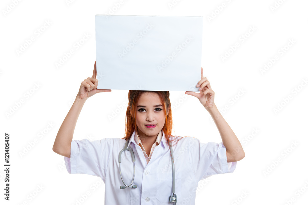 Young Asian female doctor show a blank sign over head. Young Asian female doctor show a blank sign over head.