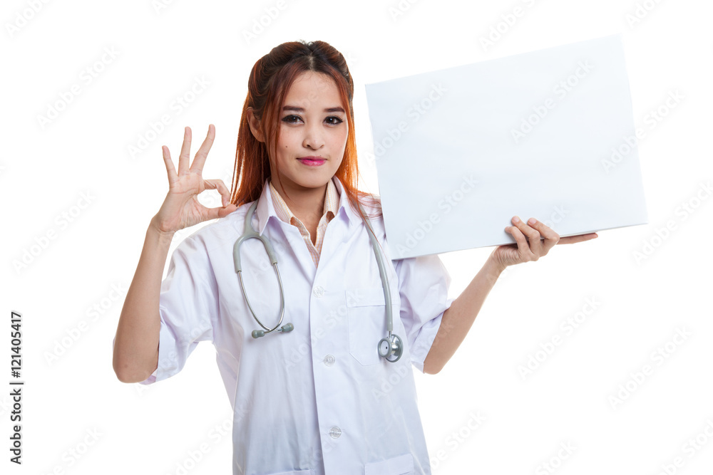 Young Asian female doctor show a blank sign and OK sign. Young Asian female doctor show a blank sign and OK sign.