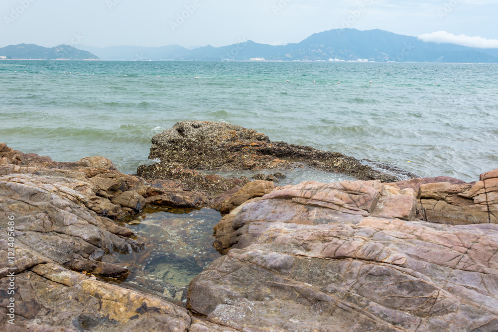 Rocky seashore and islands in Shenzhen bay, China.