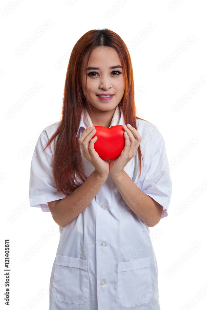 Asian young female doctor hold a red heart and smile. Asian young female doctor hold a red heart and smile.