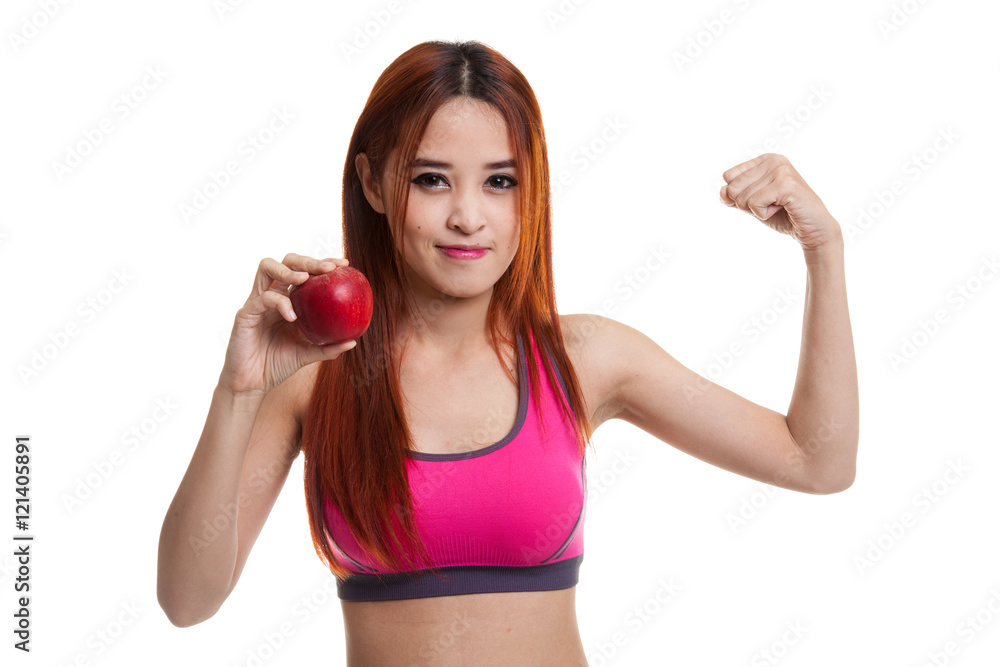 Beautiful Asian healthy girl flexing biceps with red apple. Beautiful Asian healthy girl flexing biceps with red apple.